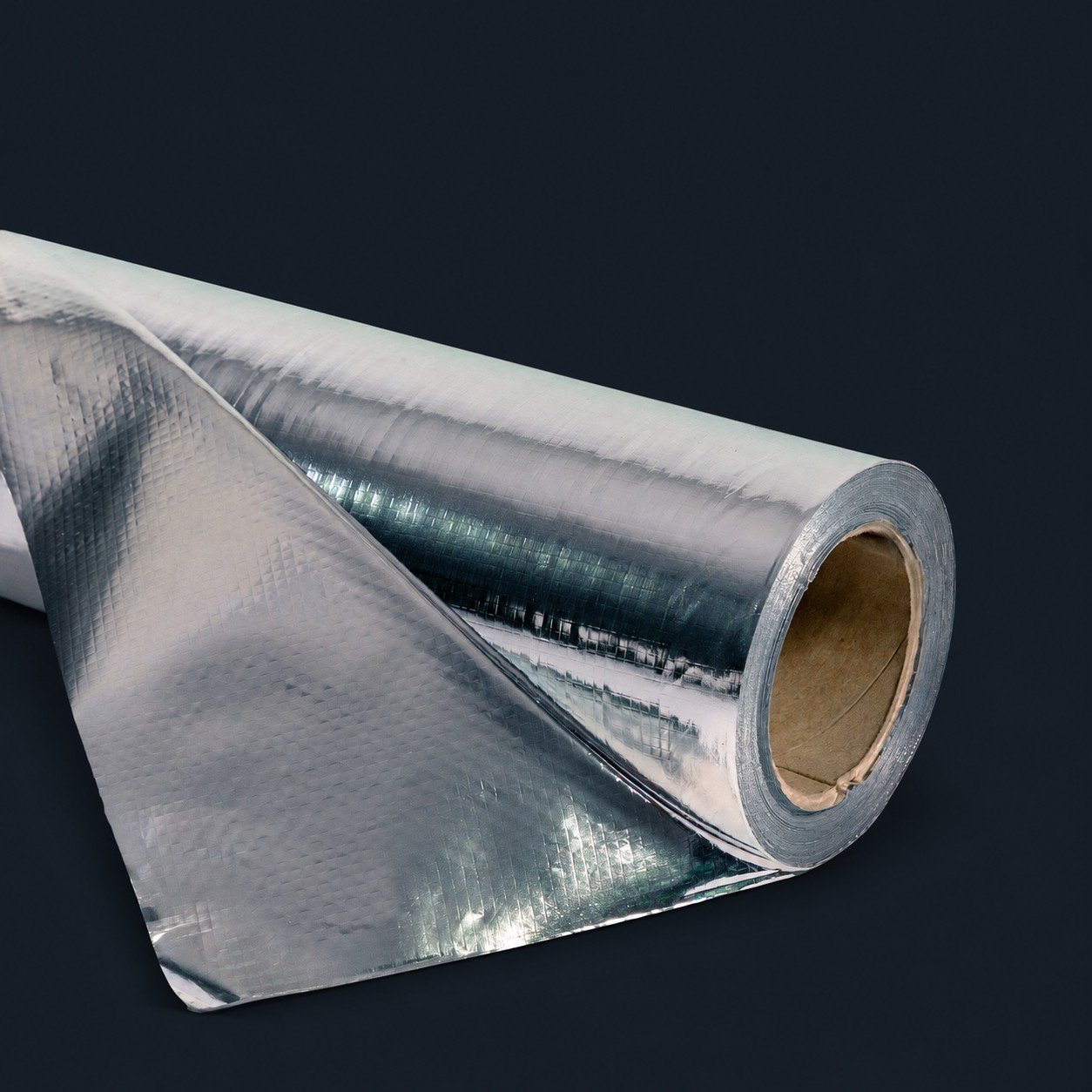 Appearance reference of an unprinted solid reflective foil roll with a woven grid texture and cardboard core